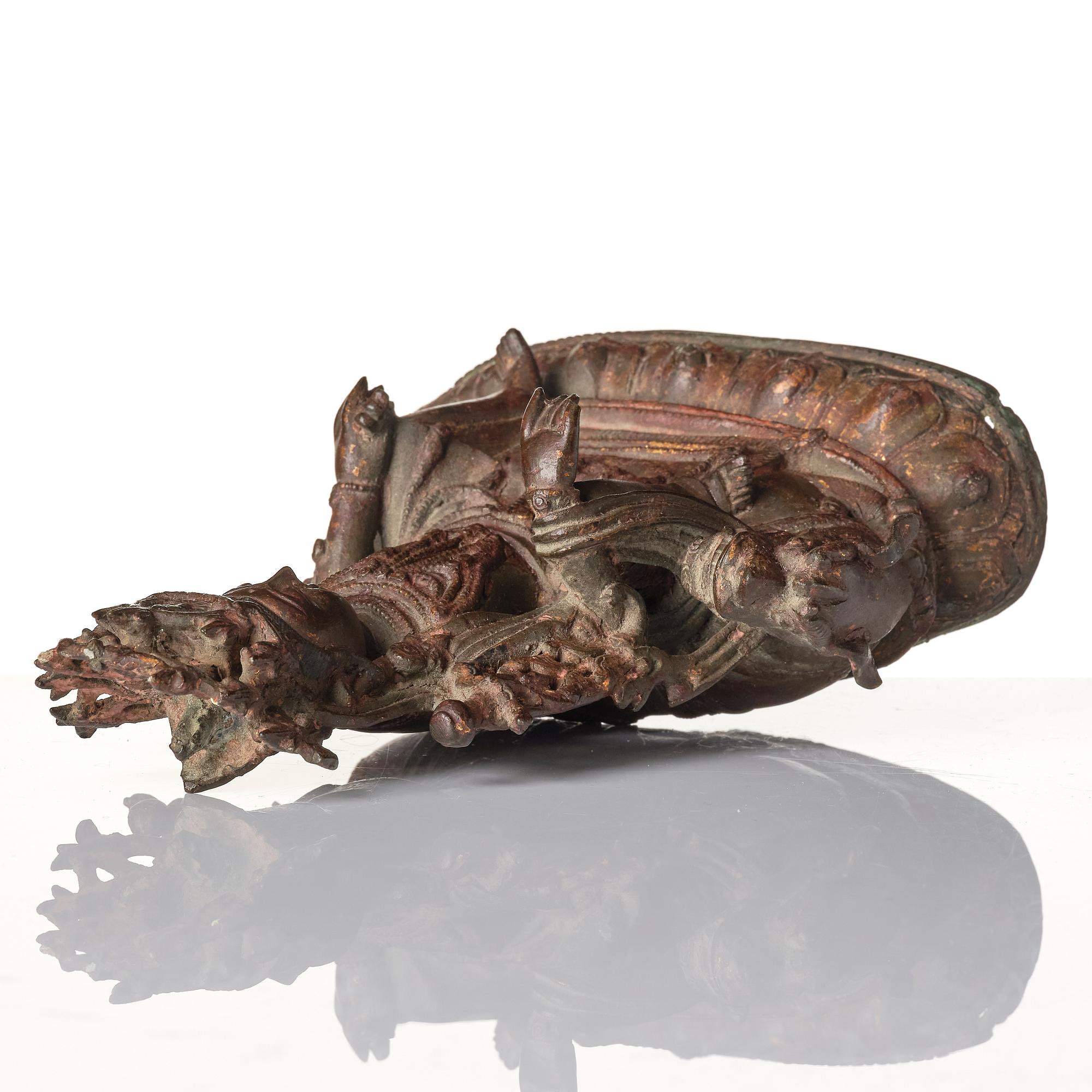 A Chinese bonrze figure of a Budha, probably late Ming dynasty 17th century.