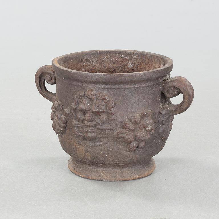 A garden pot in cast iron, model "Bacchus" by Näfveqvarns Bruk.