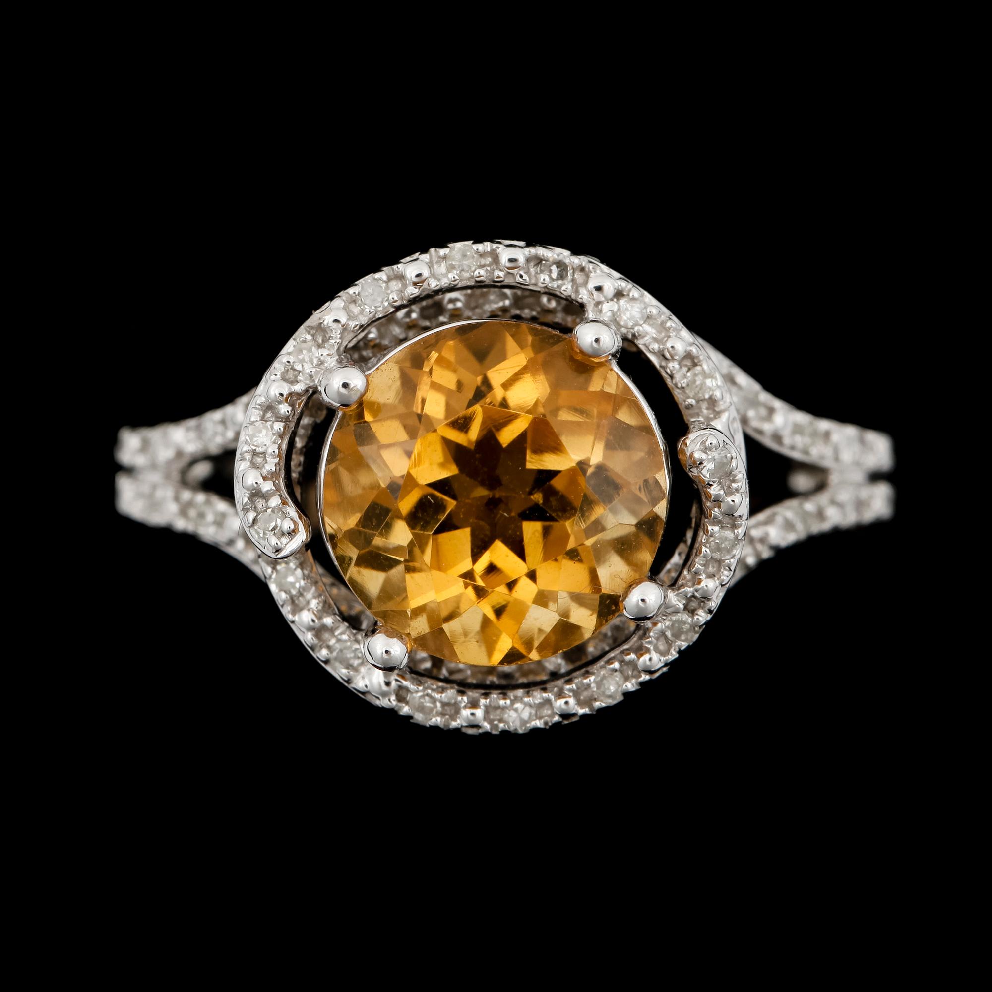 RING, 14k vitguld med gul topas med briljantslipade diamanter. 2000-tal. Vikt 4,4g.