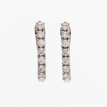 A pair of  14K gold earrings, with  brilliant-cut diamonds totalling approximately 0.56 ct.