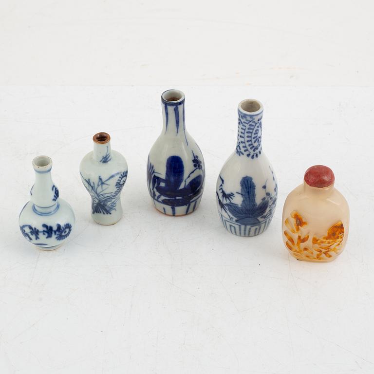 A Chinese stone snuff bottle and four porcelain miniature vases, part 18th century.