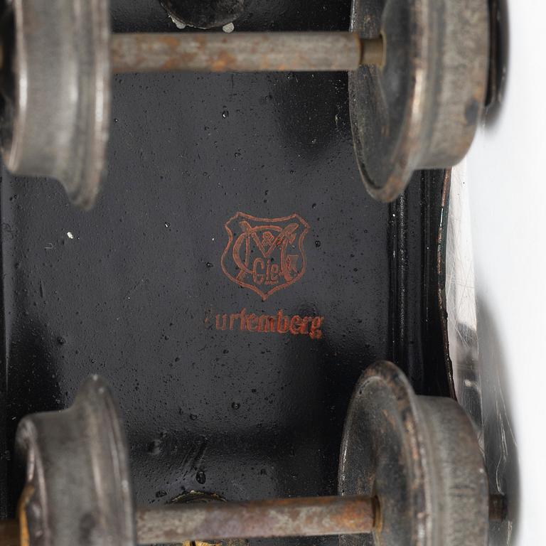 Model train with track and station building, 13 pieces, Germany, 1920s.