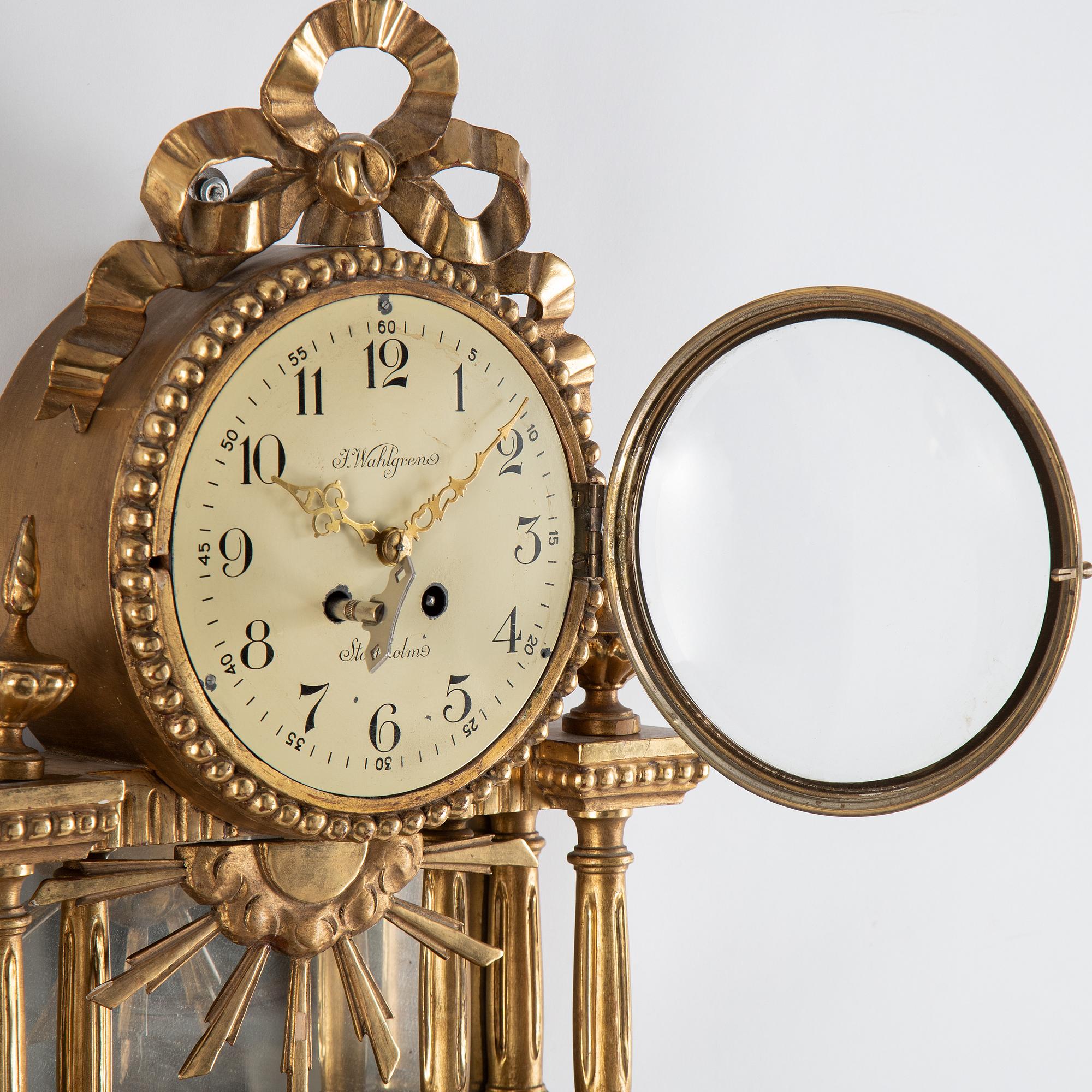 A 20th century gustavian style wall clock.