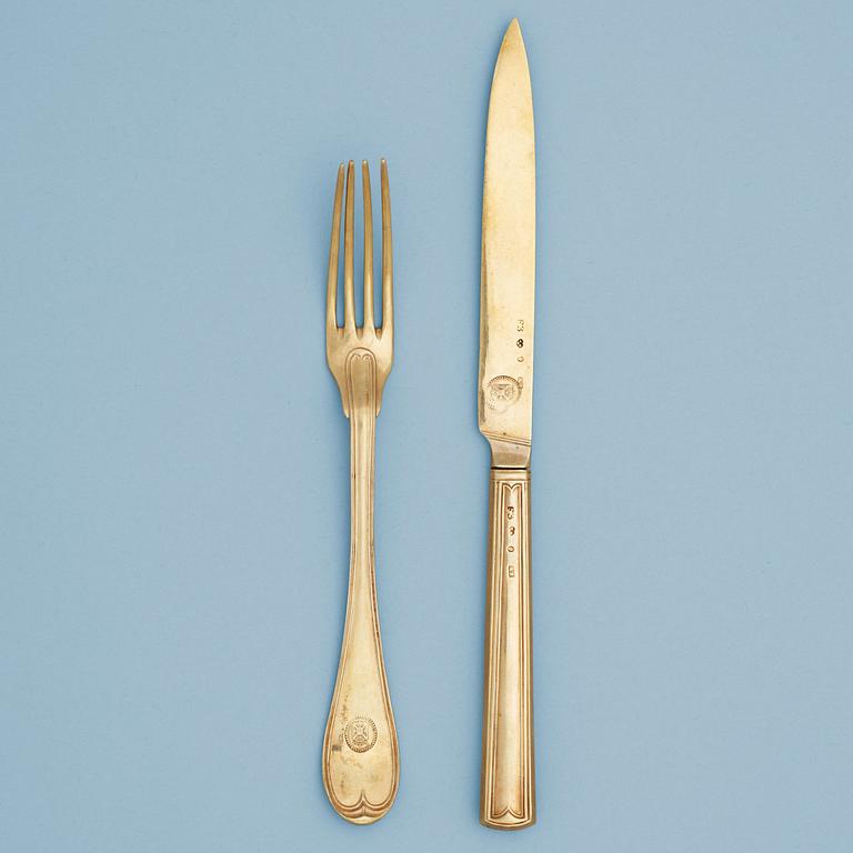 A Swedish 19th century silver-gilt set of 18 piece dessert cutlery, makers mark of Adolf Zethelius, Stockholm 1812.