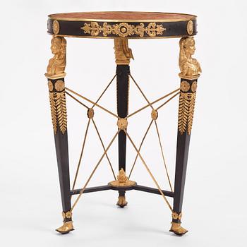 A French Empire-style gilt and patinated bronze  gueridon, later part of the 19th century.