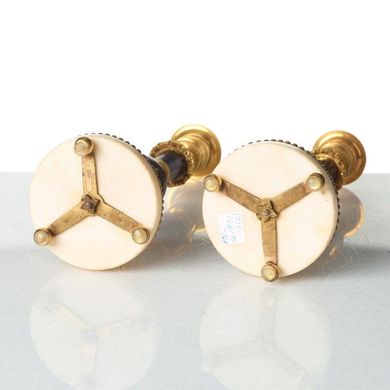 A pair of Louis XVI late 18th century candlesticks.