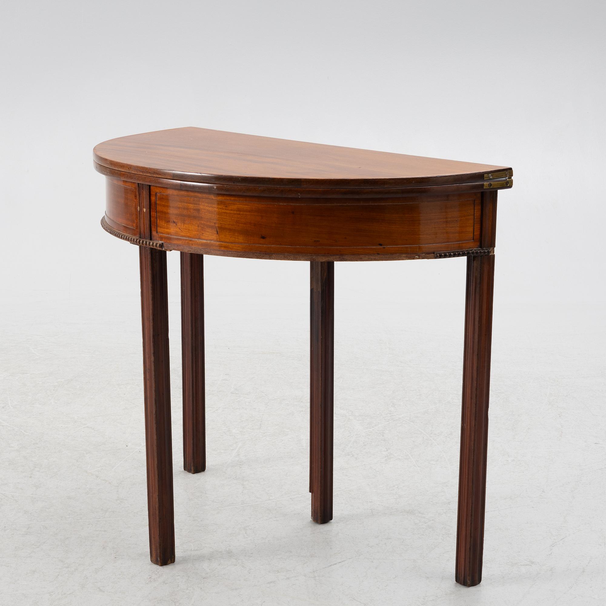 A late Gustavian mahogany games table by J. F. Wejssenburg (master in stockholm 1795-1837).