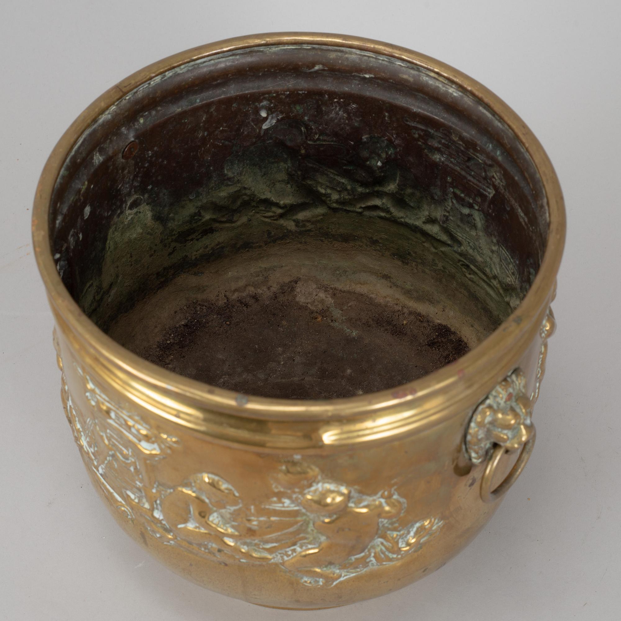 A 19th century brass flower pot.