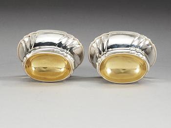 A pair of Swedish parcel-gilt salts, makers mark of Jonas Thomasson Ronander, Stockholm 1749 and 1755.