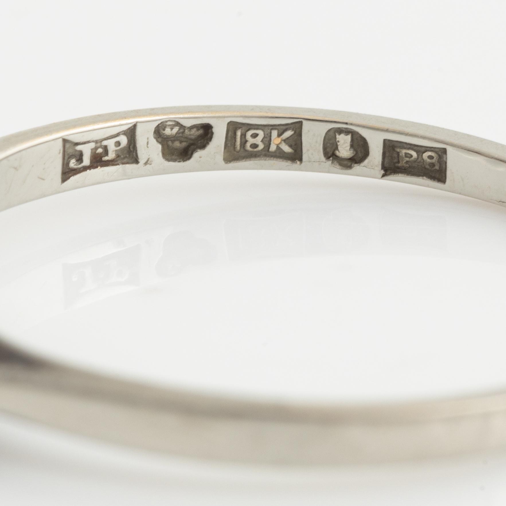 White gold and three brilliant cut diamond ring.