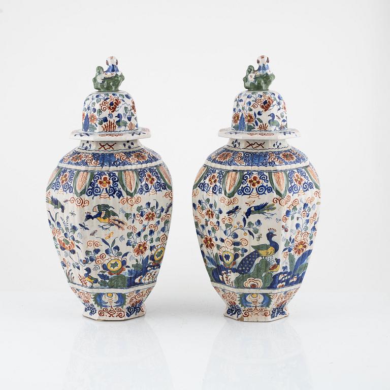 A pair of faience urns with covers, Holland, 19th / 20th Century.