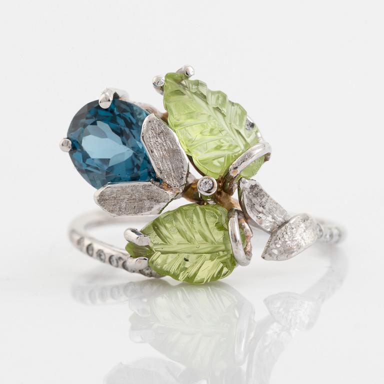 Blue topaz, carved peridot leaf, brilliant cut diamond ring.