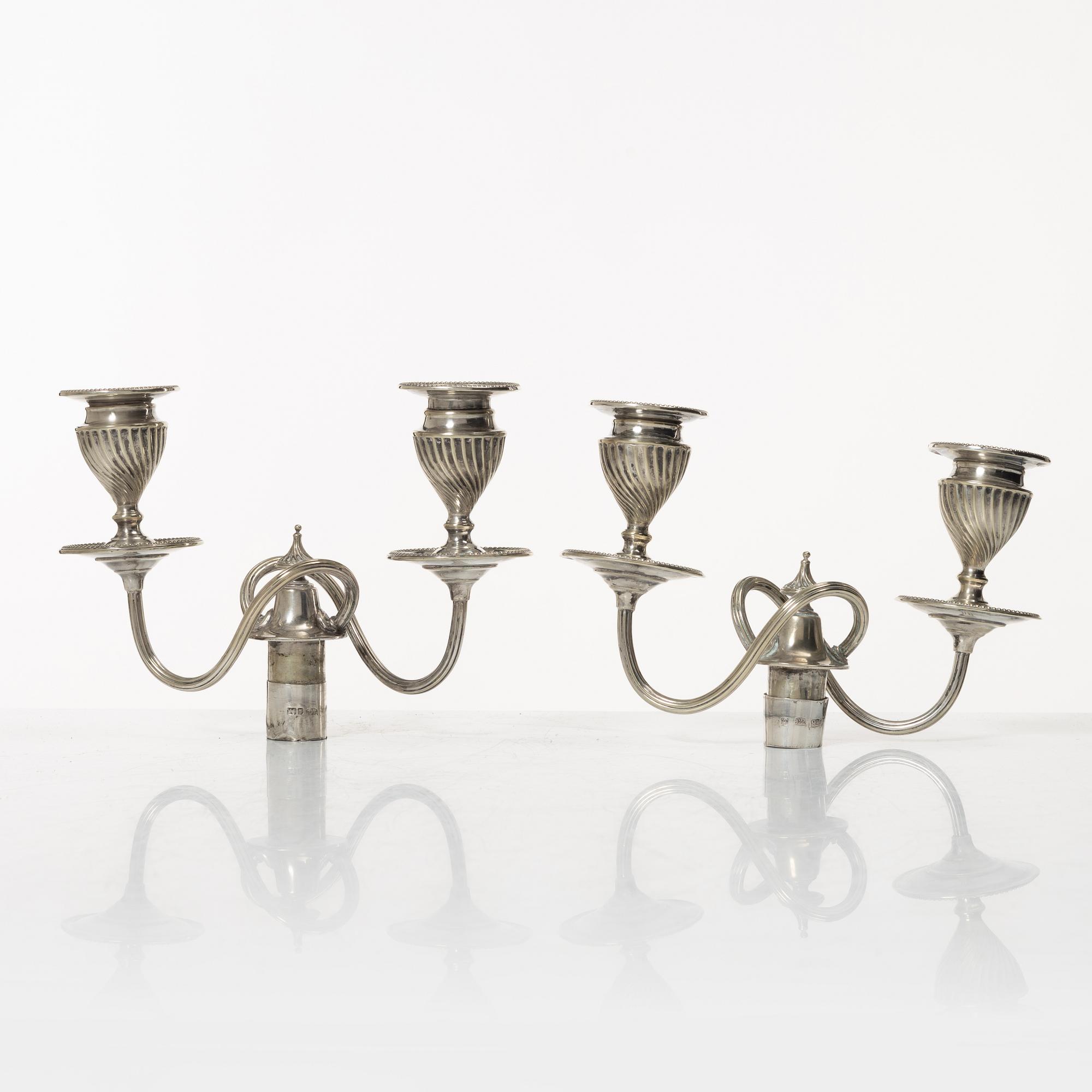 A pair of English silver candelabra, mark of Hawksworth, Eyre & Co Ltd, Sheffield 1892.