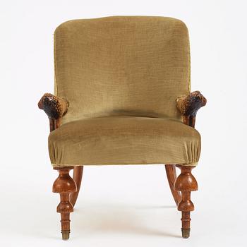 Swedish designer, a stained and carved birch folkart chair, ca 1900.