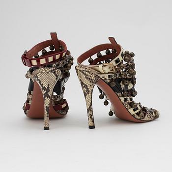 AZZEDINE ALAÏA, a pair of sandalettes with patent leather straps.