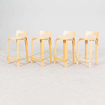 A set of four birch bar stools by Alvar Aalto, modell "K65" Artek, from the second half of 20th century.
