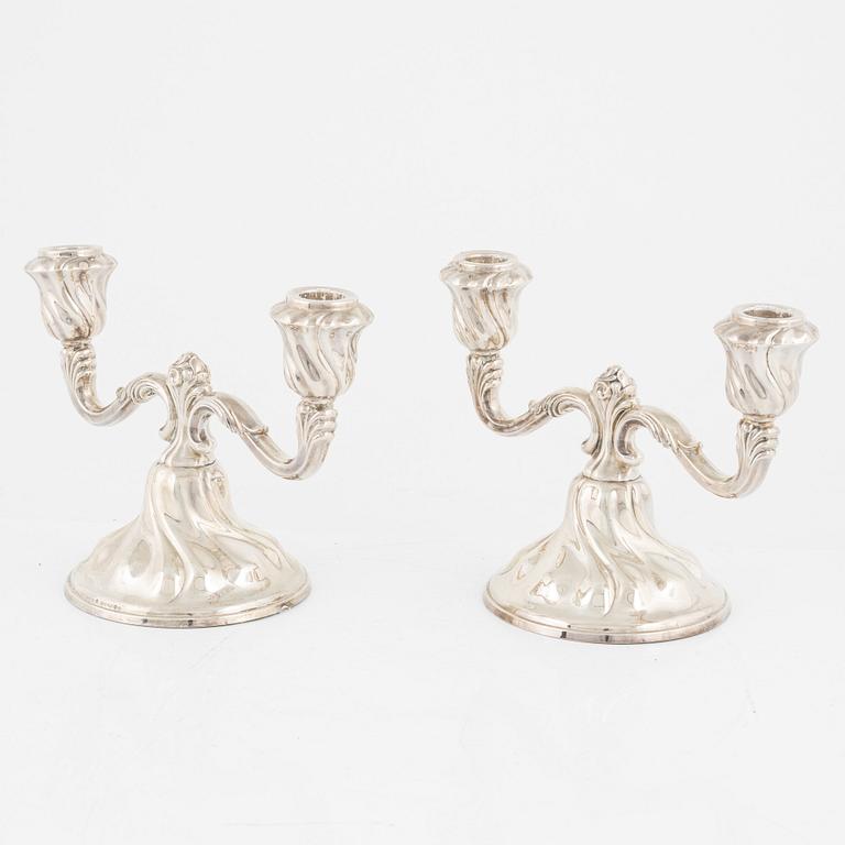 A pair of silver candelabras, first half of the 20th Century.