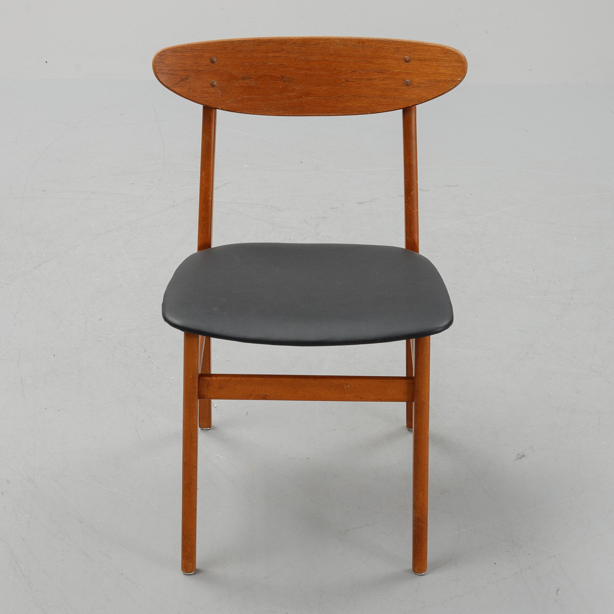 A teak dining table with 4 'Monaco' chairs, mid 20th century.