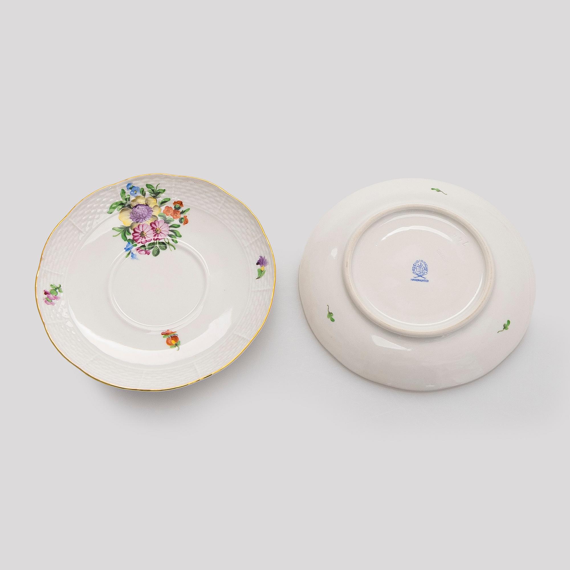 A pair of Herend porcelain candlesticks, and a lidded sugar bowl, Hungary.