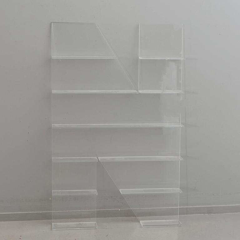 Shelf, plexi glass, in the shape of the letter 'N',Non Violence.