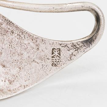 A silver belt, unidentified maker's mark.