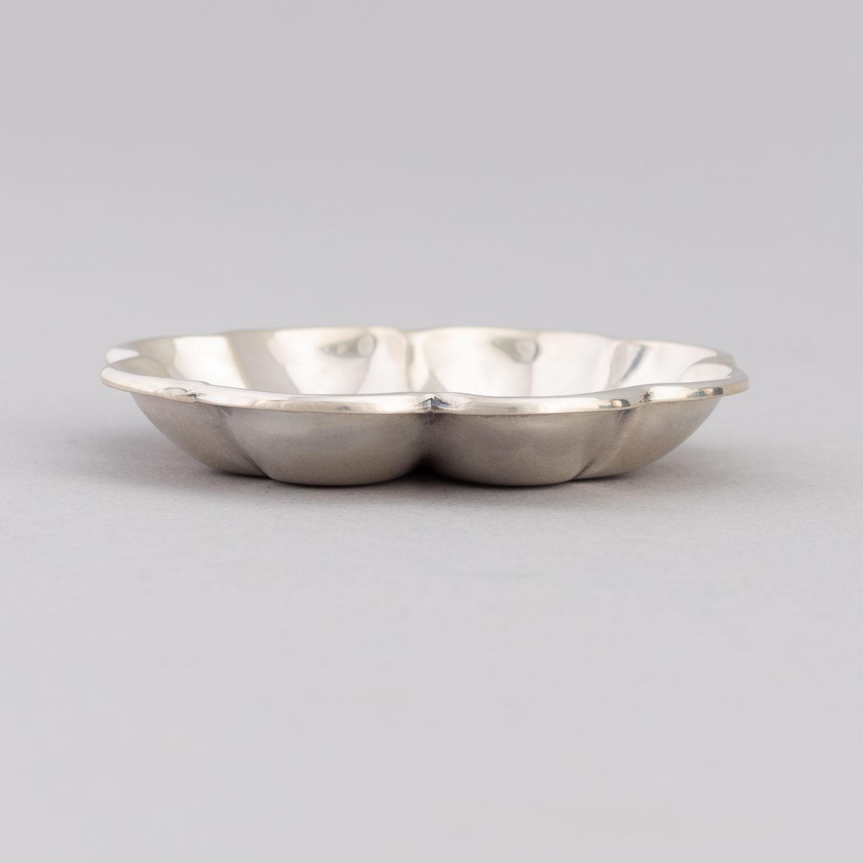 De Grisogono, a set of five silver dishes, Chopard, Switzerland.
