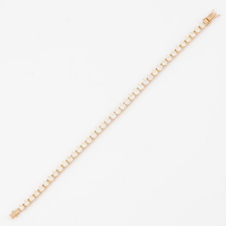 Tennis bracelet in 18K gold with brilliant-cut diamonds.
