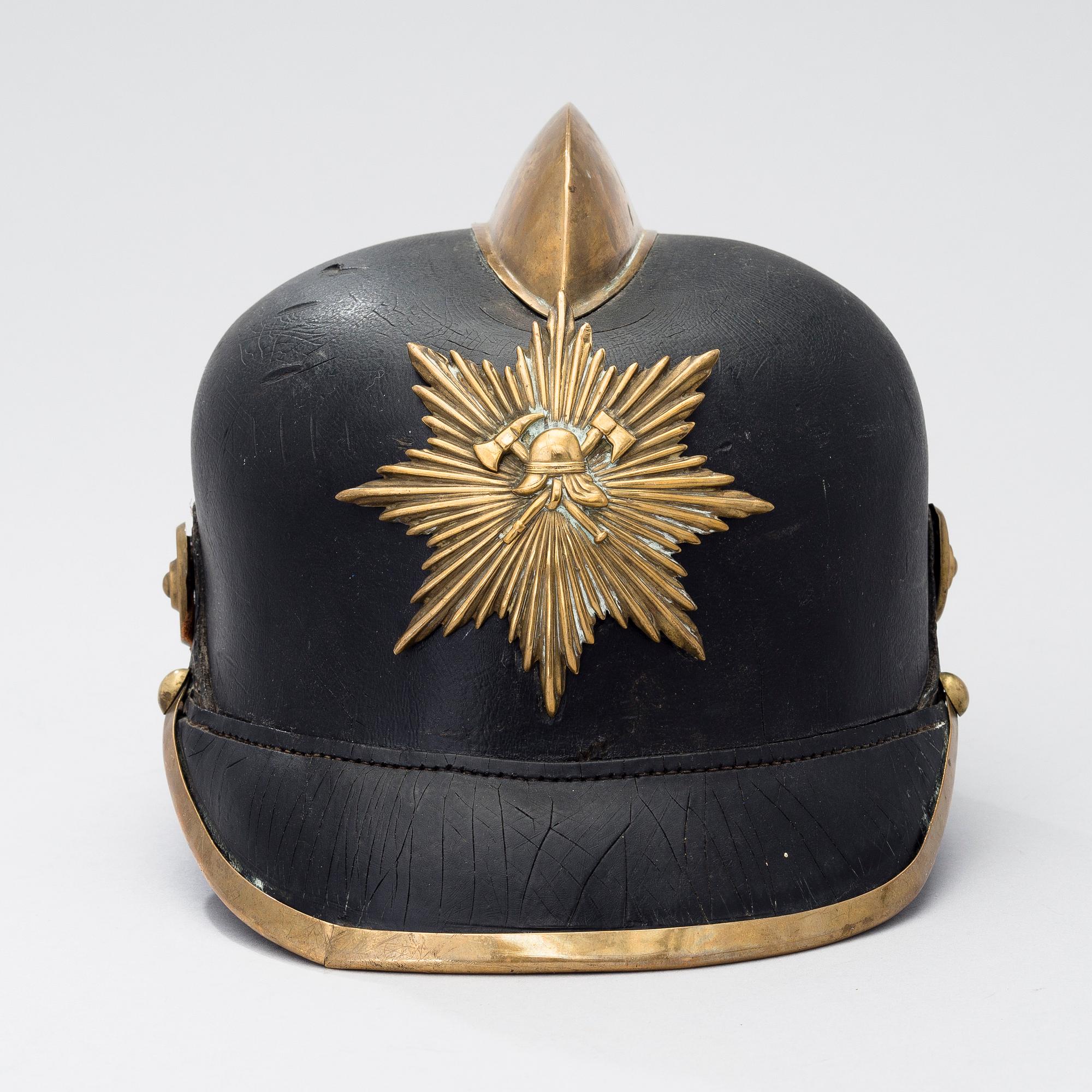 An early 20th century fireman helmet.