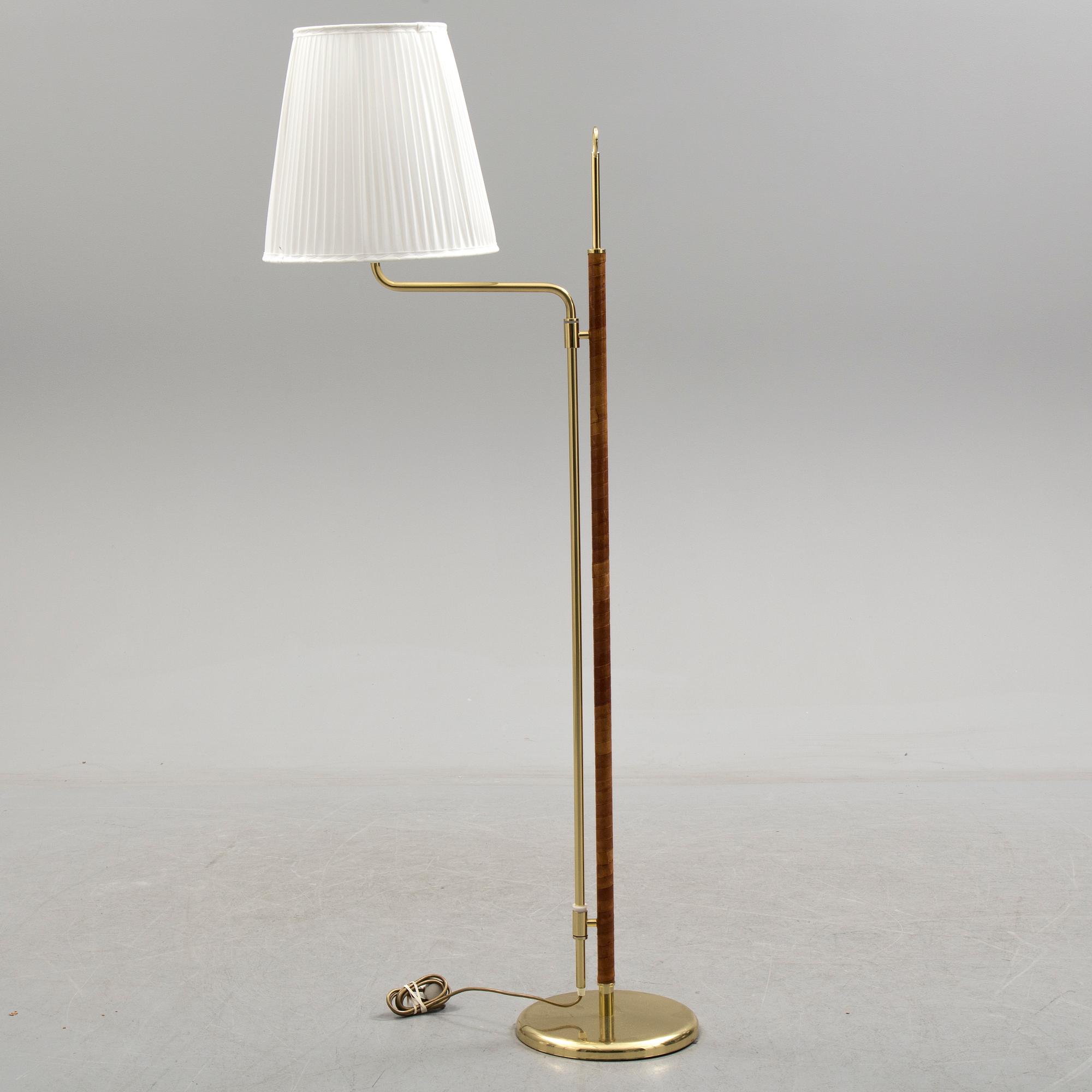 A brass and leather floor light by Örsjö industri, 21st century.