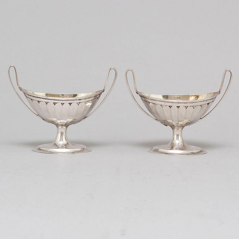 A pair of parcel-gilt empire silver salt cellars, 19th century.