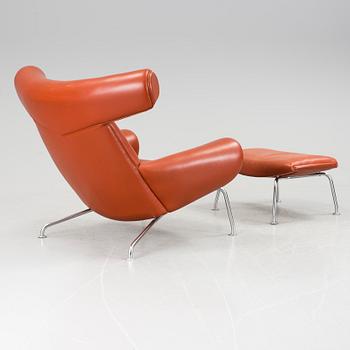 An "Ox-Chair" and foot stool by Hans J Wegner for Erik Jorgensen, Denmark.