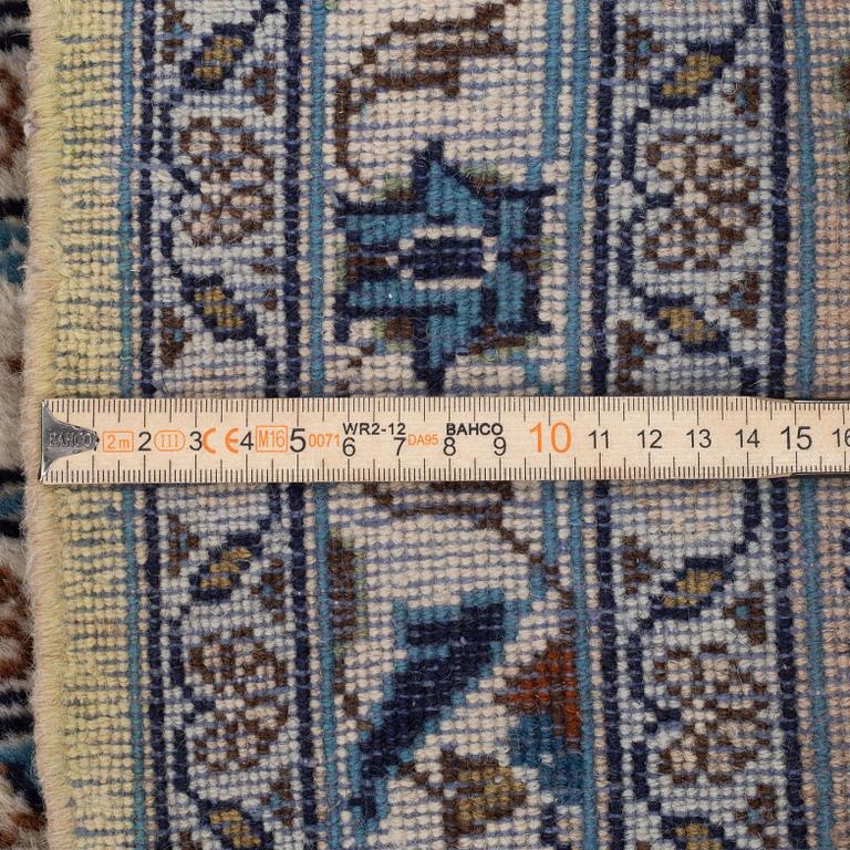 An oriental carpet, circa 378 x 282 cm.