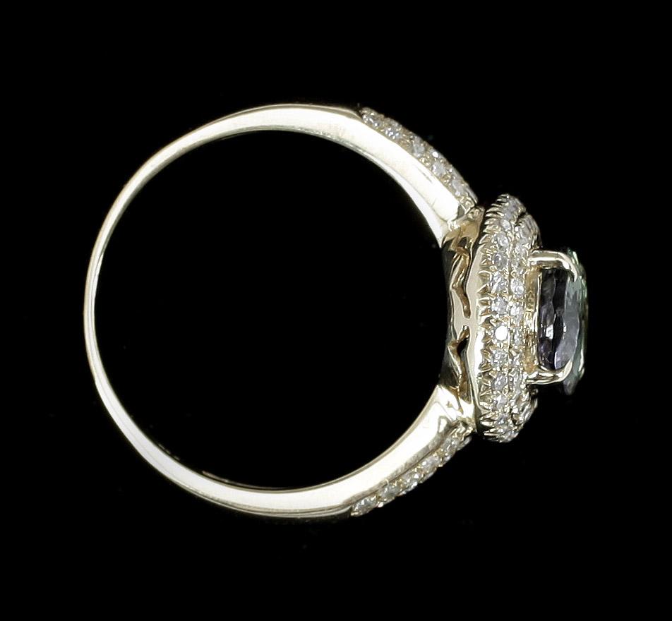 RING, 14k guld med grön zoisit enl certifikat ca2,12ct och små diamanter.. 2000-tal. Vikt 4g.