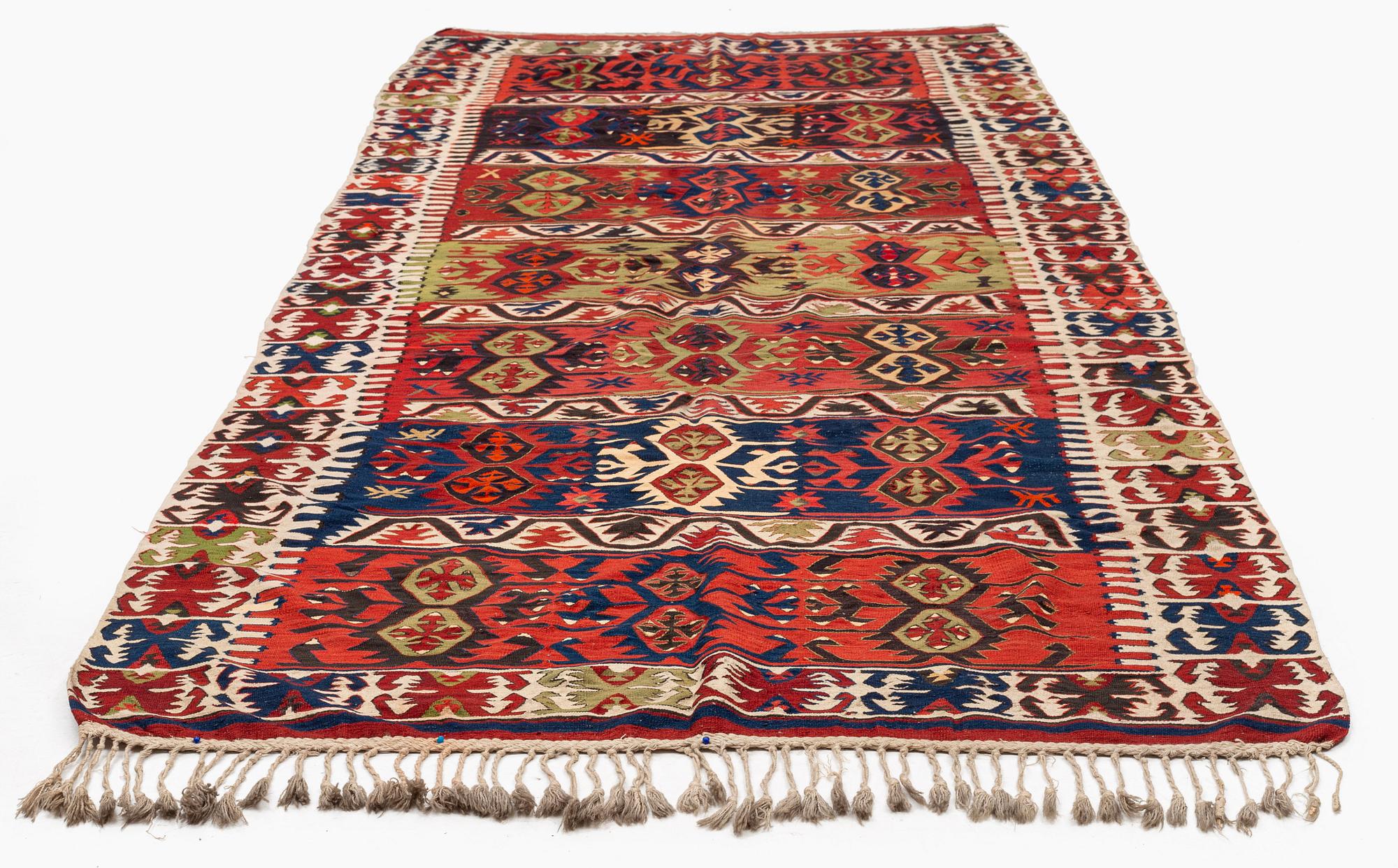 An antique southeast Anatolian kilim, c. 412 x 163 cm.