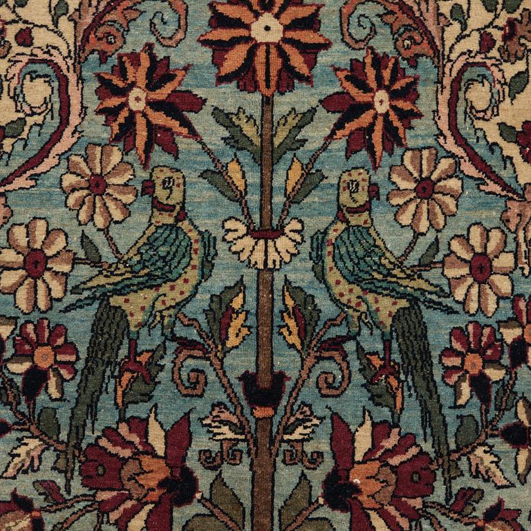 A CARPET, a semi-antique Teheran figural, 303,5 x 198-205,5 cm.