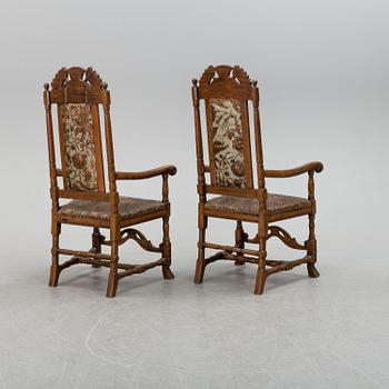 A first half of the 18th century pair of baroque oak armchairs.