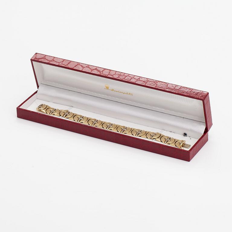 A 14K white and yellow gold bracelet.