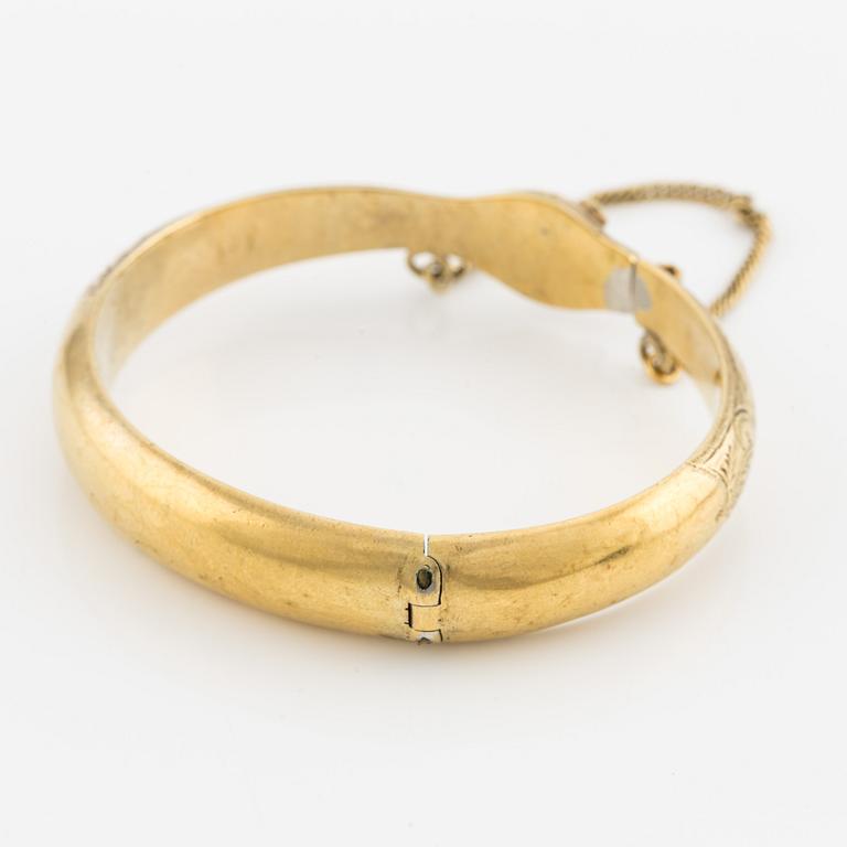 Bangle in the shape of a snake, 18K gold with garnets as eyes, Johan Gustaf Kihlberg, Nyköping 1863.