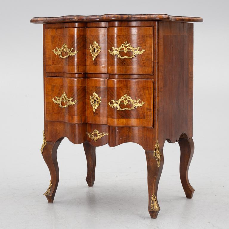 A Rococo-style chest of drawers, 19th century.