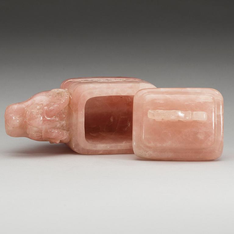 A dragon-shaped rose quartz box with cover, China.