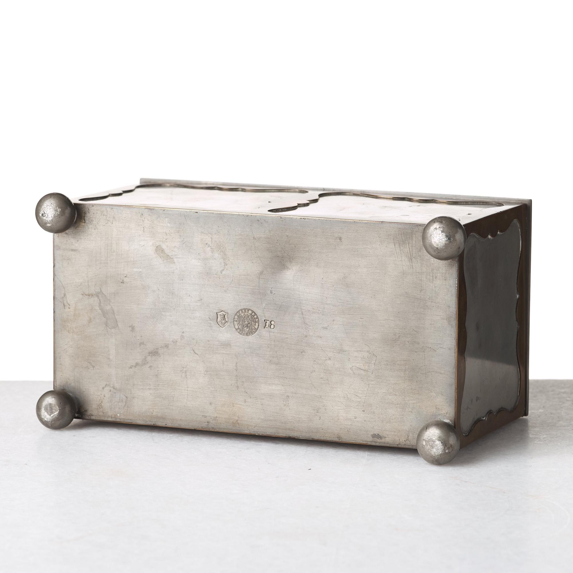 Firma Svenskt Tenn, a pewter and brass box, Stockholm 1930, model A 854.
