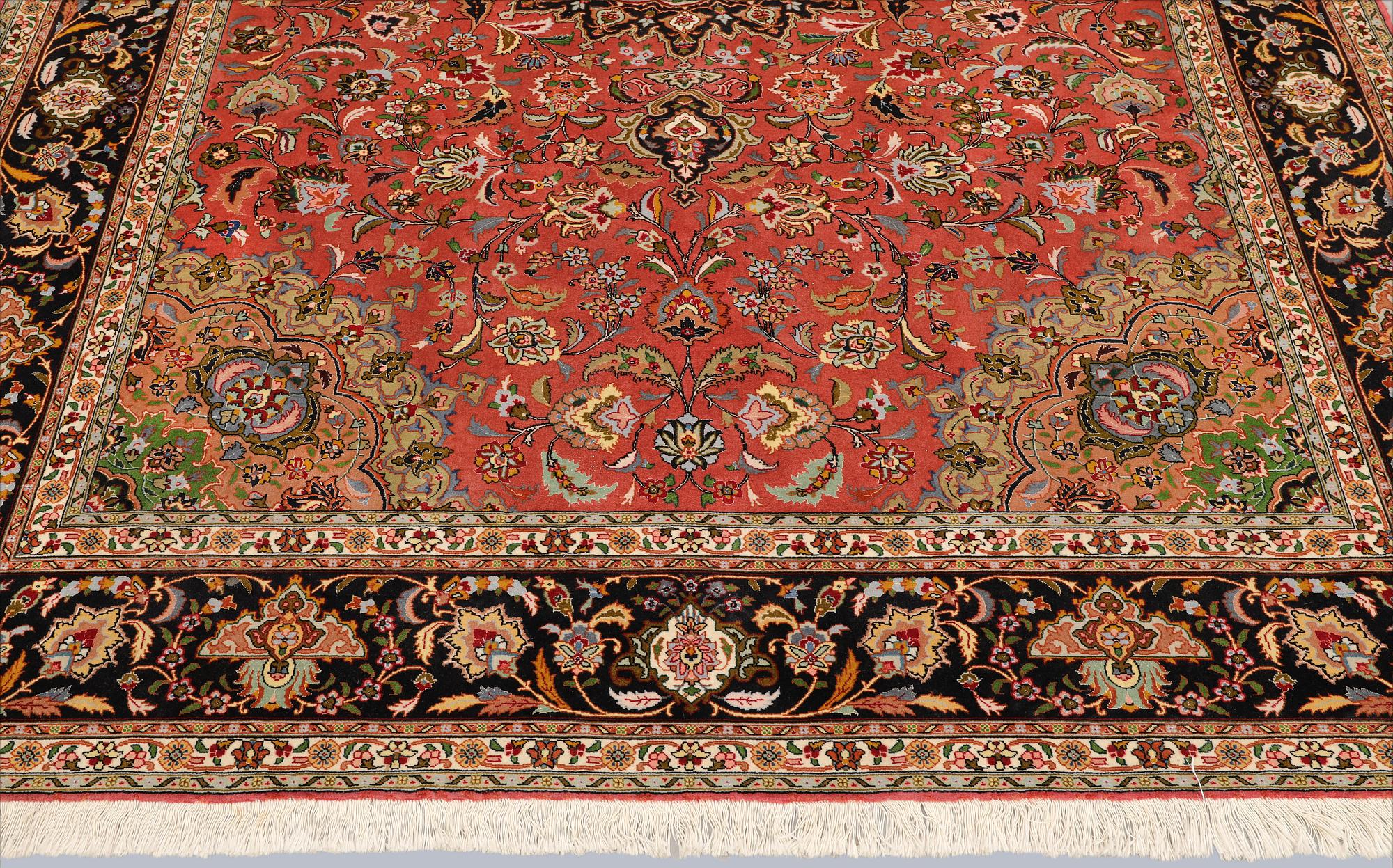 A part silk Tabriz carpet, approx. 50 Raj, 292 x 202 cm.