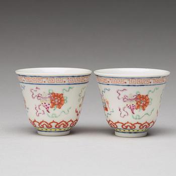 A pair of Chinese famille rose ba jixiang wine cups, Republic, with Guangxu six character mark.