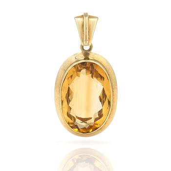 A pendant set with oval, mixed-cut citrine.