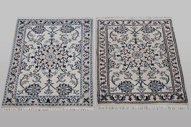 A pair of rugs, Nain, part silk, ca 83 x 58 cm & ca 80 x 60 cm.