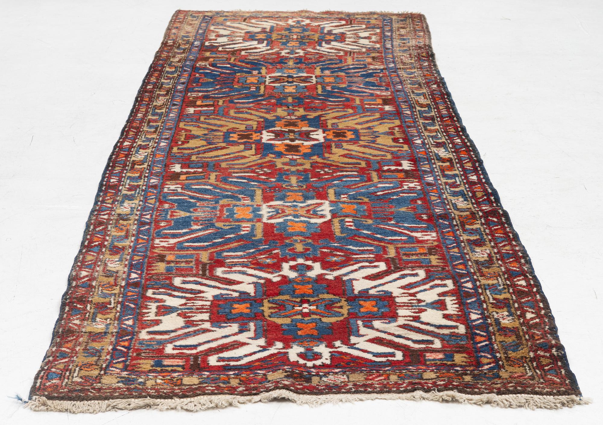 A runner carpet, North Western Iran, c. 317 x 107 cm.