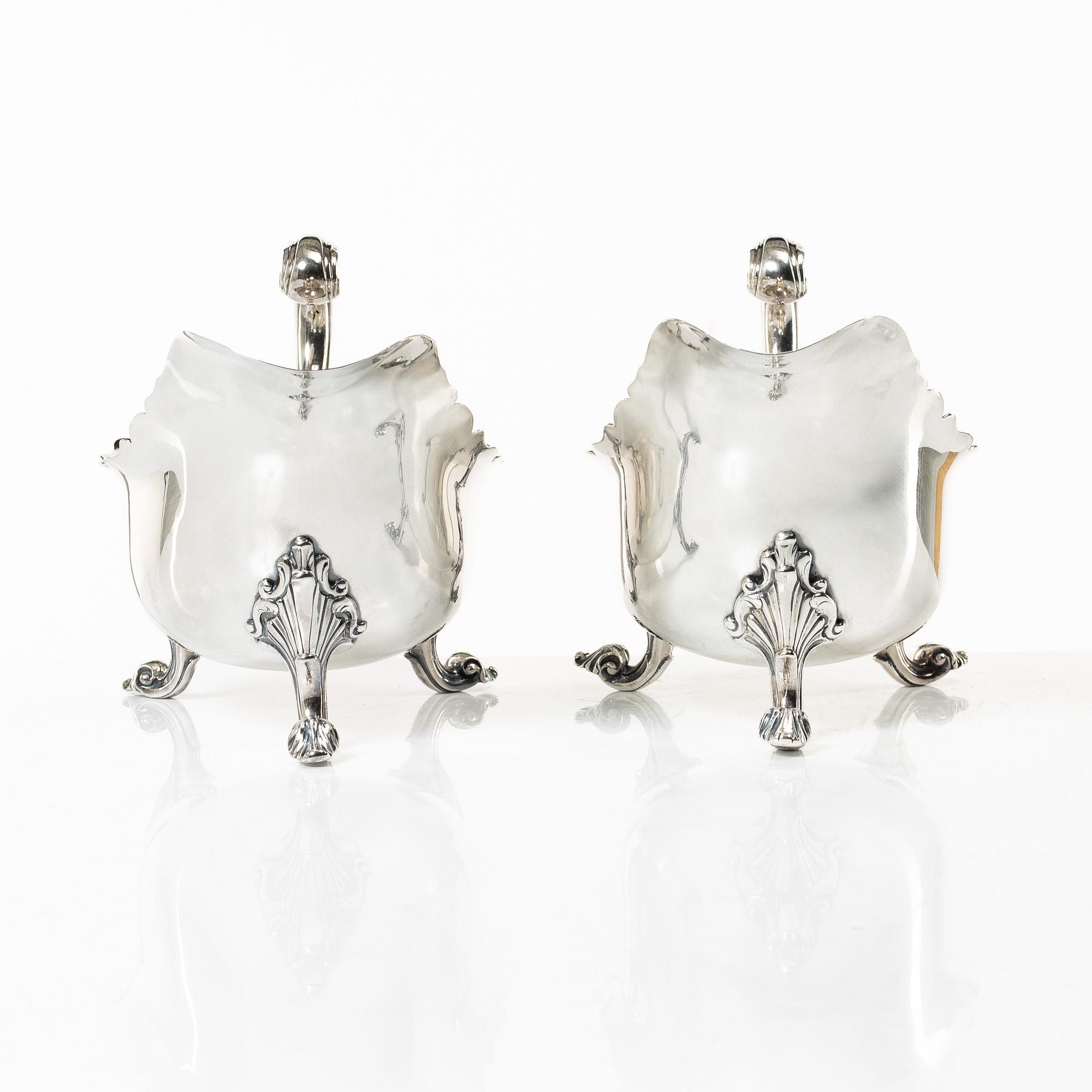 A pair of 18th century silver sauce boats, Richard William, Ireland, spoons, Peter & William Bateman, London 1807.