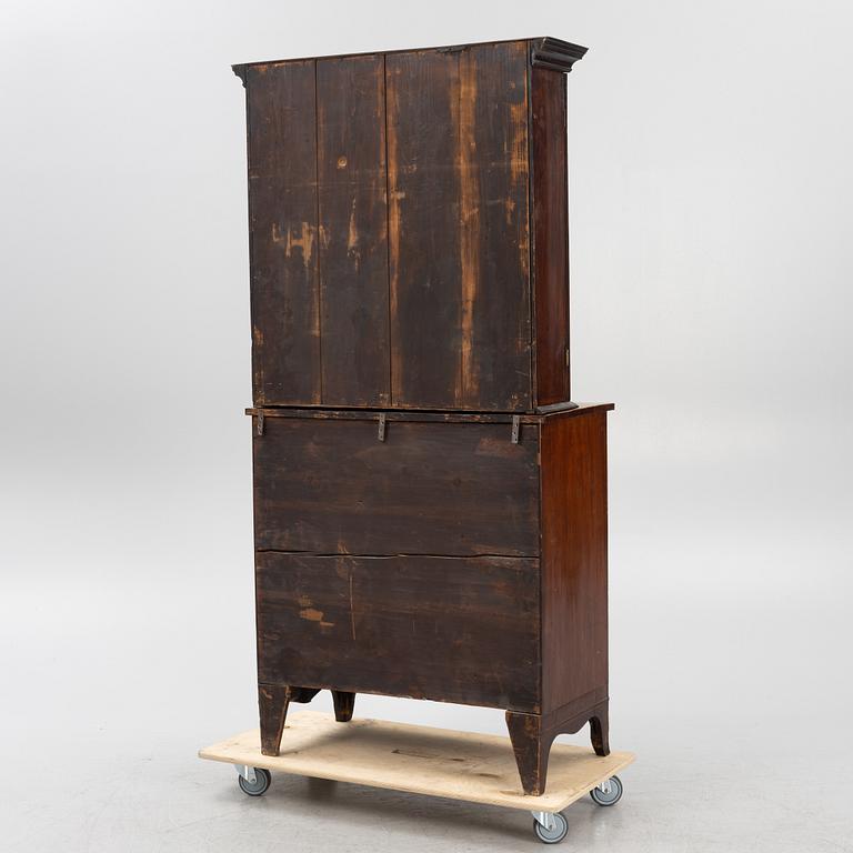 A 19th Century matced mahogany veneered cabinet.