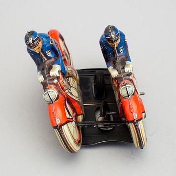 A tinplate synchronous motorcycle by Philipp Niedermeier, Germany, 1950s.