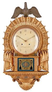 535. A Swedish Empire wall clock by J. Cederlund.